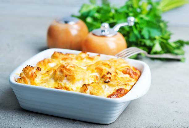 gratin gratin with cauliflower and cheese on a table casserole stock pictures, royalty-free photos & images