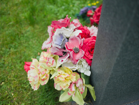 flowers on a grave in a churchyard