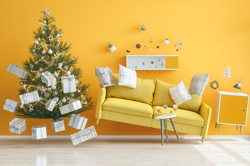 Gravity Concepts. Yellow Living Room with Christmas Tree