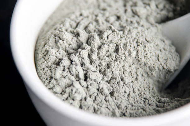 Gray bentonite clay powder in a bowl. Diy facial mask and body wrap recipe. Natural beauty treatment and spa. Clay texture close up. Selective focus. Gray bentonite clay powder in a bowl. Diy facial mask and body wrap recipe. Natural beauty treatment and spa. Clay texture close up. Selective focus. clay stock pictures, royalty-free photos & images