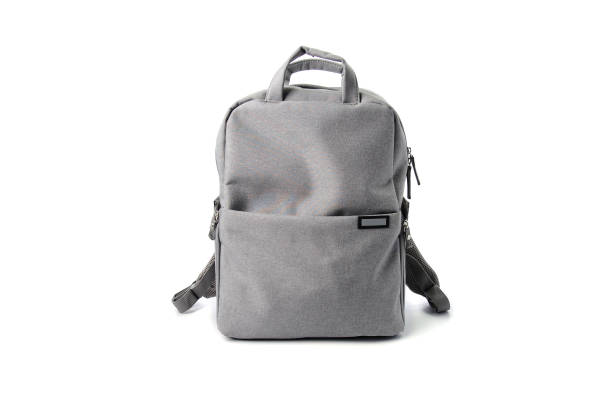 gray school bag isolated on white gackground - backpack stockfoto's en -beelden