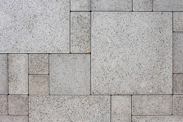 Gray square bricks Gray square bricks - geometric background granitic stock pictures, royalty-free photos & images