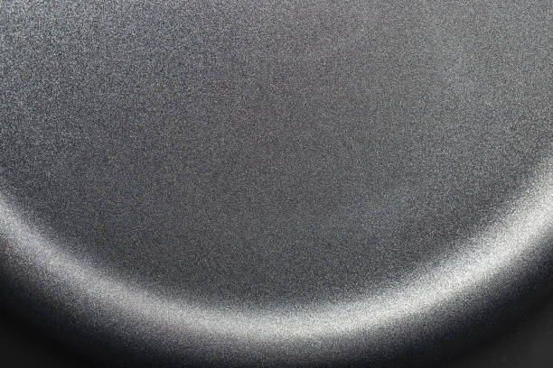 Gray titanium texture, metallic luster macro photo Gray titanium texture, metallic luster macro photo, titanium frying pan close up iridium stock pictures, royalty-free photos & images