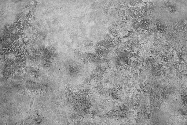 gray,textured, wall background. - gevlekt stockfoto's en -beelden