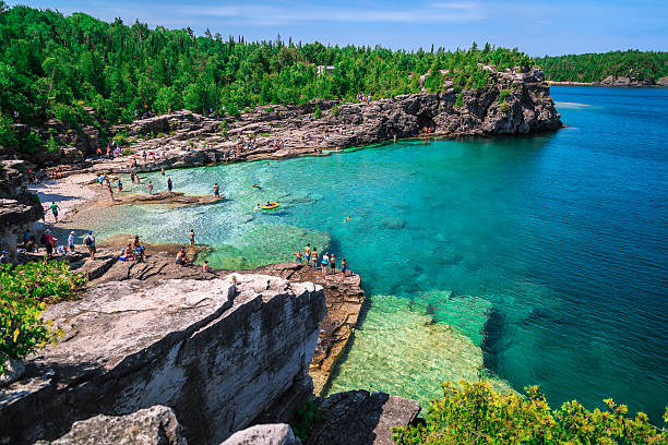 great amazing view of lake Huron rocky beach gorgeous amazing stunning  view of lake Huron rocky beach landscape with people in background   bruce peninsula stock pictures, royalty-free photos & images