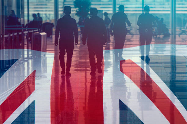 Great Britain Flag as Background and Silhouettes People, concept business picture stock photo