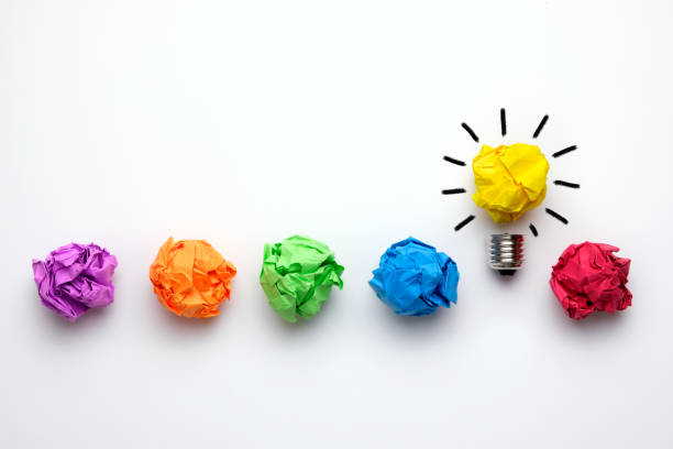 Great idea concept with crumpled colorful paper and light bulb stock photo