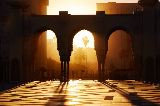 Great mosque of Hassan 2 at sunset in Casablanca, Morocco. Beautiful Arches of the Arab mosque in the sunset, sunlight rays Great mosque of Hassan 2 at sunset in Casablanca, Morocco. Beautiful Arches of the Arab mosque in the sunset, sunlight rays casablanca morocco stock pictures, royalty-free photos & images
