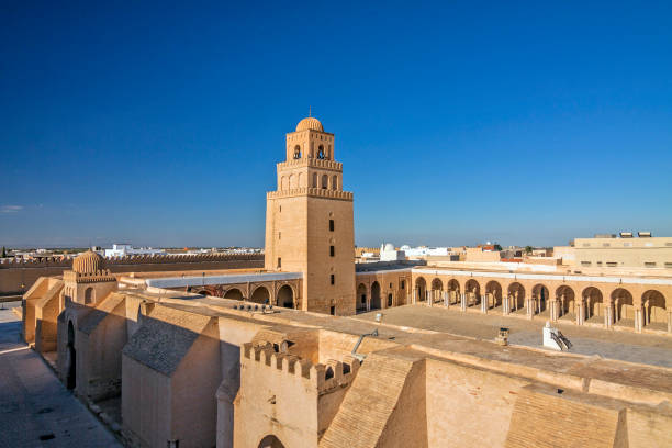 Great mosque of Sidi-Uqba. Kairouan, Tunisia Tunisia - Kairouan - The panoramic view of fortress-like Great Mosque aka the Mosque of Sidi-Uqba and its minaret (built 9th century) are listed as UNESCO World Heritage and is one of the most impressive and largest Islamic monuments in North Africa medina district stock pictures, royalty-free photos & images
