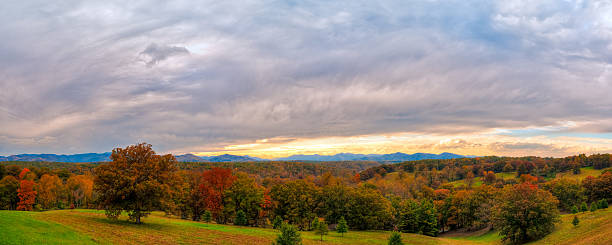 Great Smoky Mountains, sunset, Asheville, North Carolina "A panoramic view towards Asheville and the Great Smoky Mountains, North Carolina, USA and showing the beautiful fall colours and a dramatic cloudscape. Taken on a late October evening in low light, just before sunset.More images of the Great Smoky Mountains and Blue Ridge Parkway in this lightbox:" high country stock pictures, royalty-free photos & images