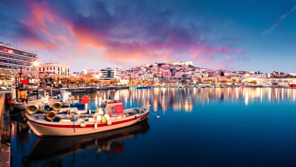 Great spring seascape on Aegean Sea. Colorful evening panorama of Kavala city, the principal seaport of eastern Macedonia and the capital of Kavala regional unit. Greece, Europe. stock photo