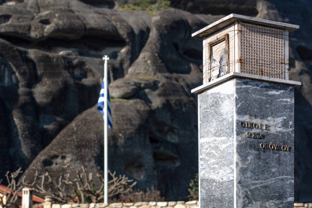 Greece Flag and A Monument in the Area of Monasteries stock photo