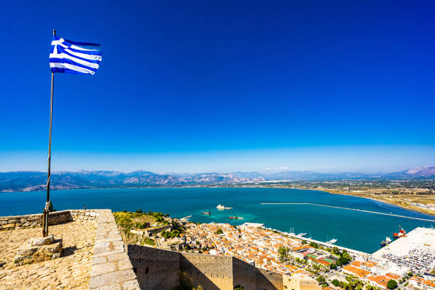 Greek Flag waving on Palamidi Fortress in Nafplion, Argolis - Greece Greek Flag waving on Palamidi Fortress in Nafplion, Argolis - Greece. High quality photo peloponnese stock pictures, royalty-free photos & images