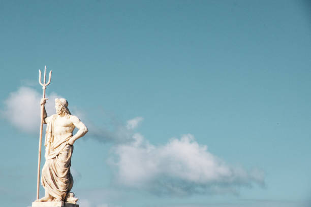 greek god of sea poseidon statue god of sea poseidon statue clear blue sky background poseidon statue stock pictures, royalty-free photos & images