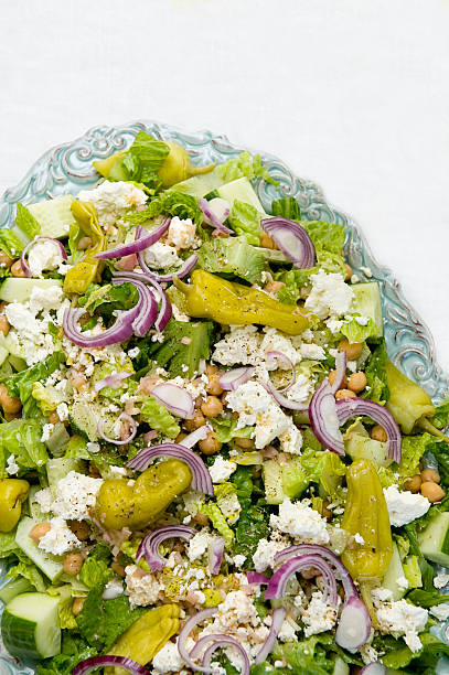 Greek salad on blue plate stock photo