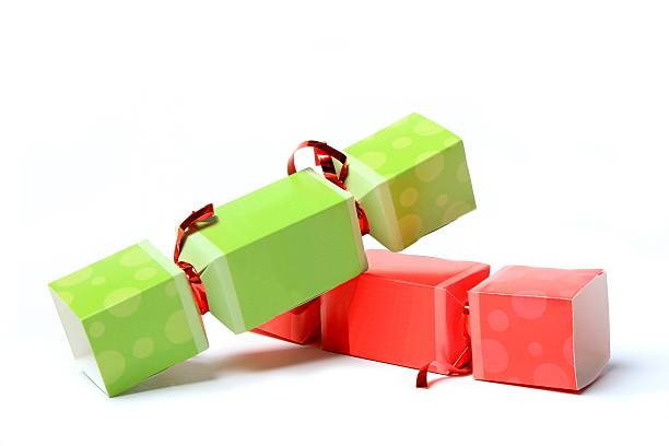 Green and Red Party Crackers on white background stock photo