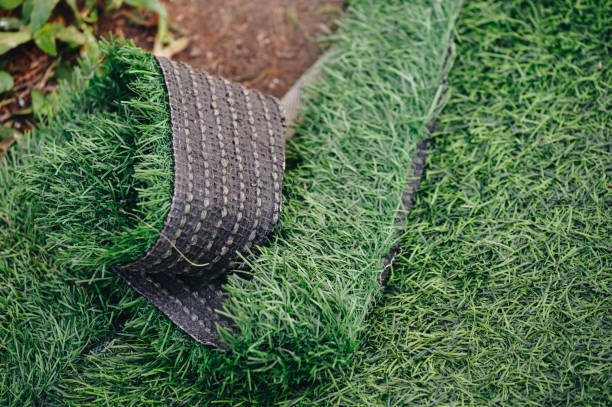 Green artificial turf used for covering sport arena or garden. stock photo