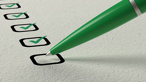 Green ball pen crossing off items from a checklist Green ball pen crossing off items from a checklist on white paper 3D illustration checklist stock pictures, royalty-free photos & images