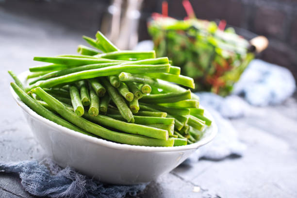 green beans and salad green beans in bowl and fresh leaves of mangold green bean stock pictures, royalty-free photos & images