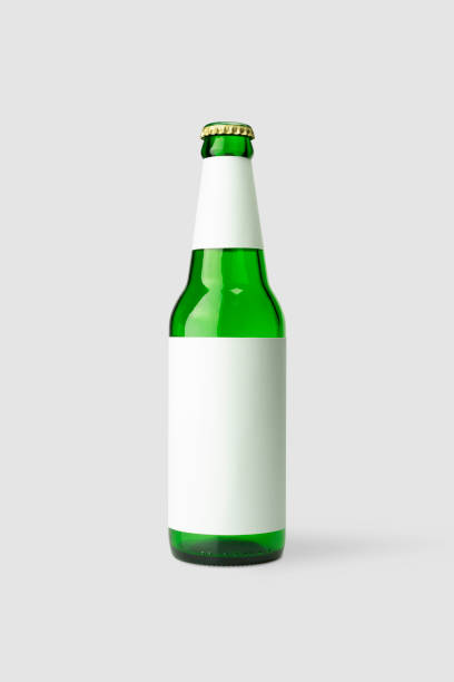 green beer bottle with blank white label, clipping path - empty beer bottle imagens e fotografias de stock