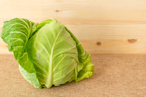 Green cabbage close up on rustic background with copy space stock photo