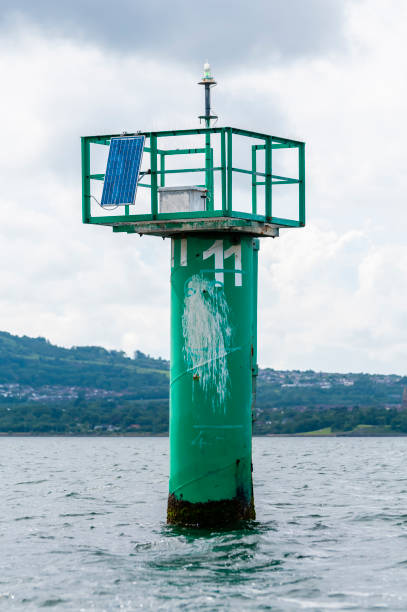 Green channel marker with the number 11 in Belfast Lough Green channel marker with the number 11 in Belfast Lough strangford lough stock pictures, royalty-free photos & images