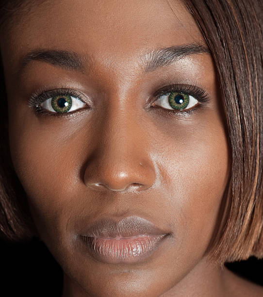 Ebony with green eyes