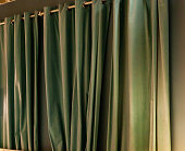 istock Green curtain background 1387816930