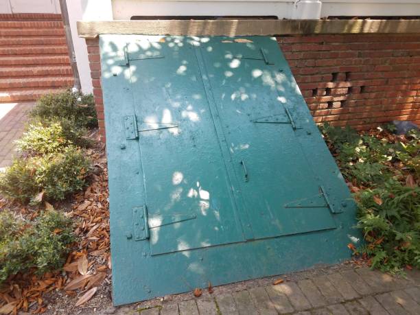 green door to basement or cellar stock photo