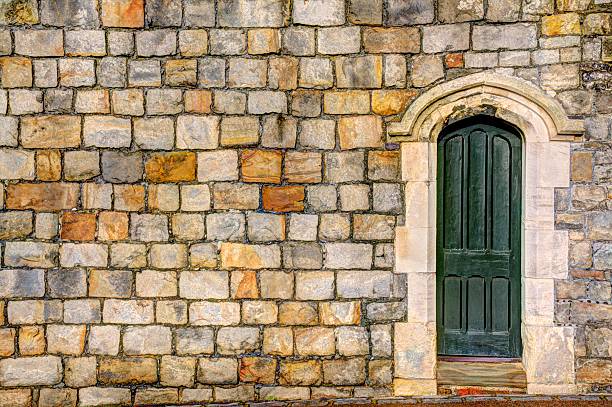 Green door with masonry wall stock photo
