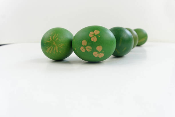 Green easter eggs with plant leaf pattern stock photo