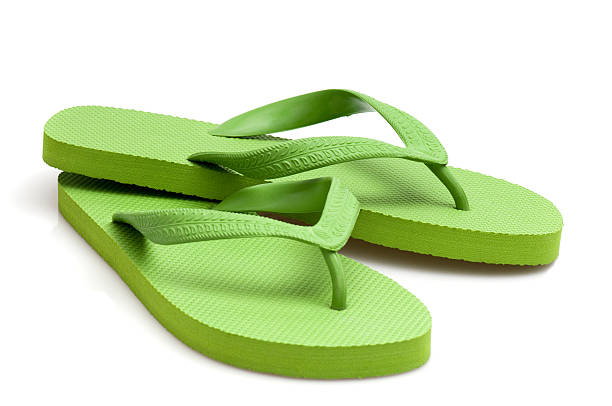 green flip-flop flip-flop isolated on white flip flop stock pictures, royalty-free photos & images