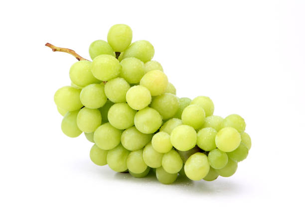 green grapes on a white background. green grapes on a white background. grape stock pictures, royalty-free photos & images