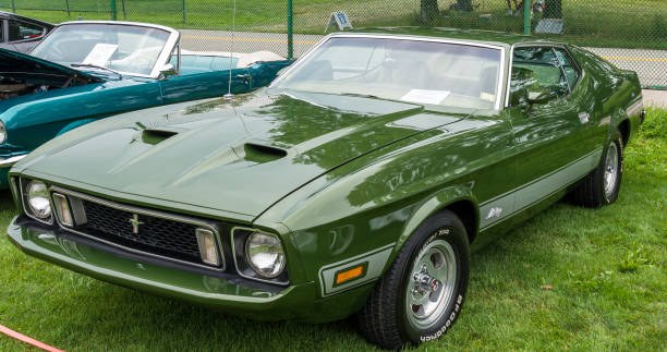 A 1973 green Mustang Mach 1 on display at the Pittsburgh Vintage Grand Prix, a yearly event for the past 38 years that holds public car shows leading up to the race in Schenley Park stock photo