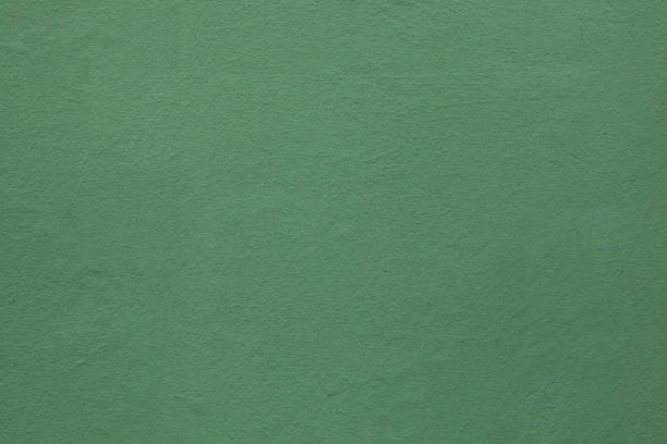 Green painted stucco wall. stock photo
