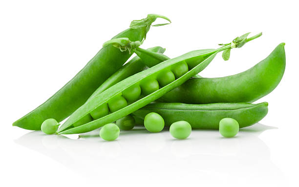 Green peas isolated on white background Green peas isolated on a white background broad bean stock pictures, royalty-free photos & images
