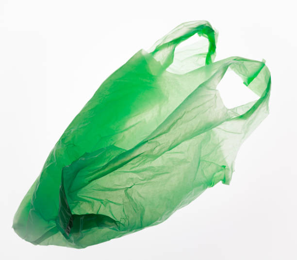 Green plastic bag isolated on white. stock photo