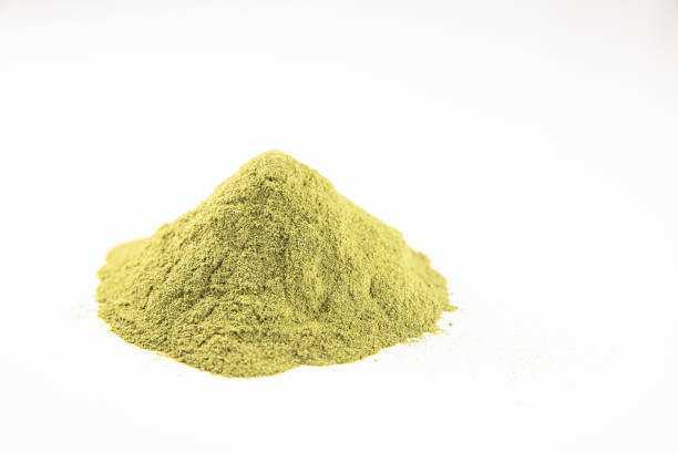 Green powder from dried fruits, vegetables and herbs Green powder from dried fruits, vegetables and herbs colored powder photos stock pictures, royalty-free photos & images