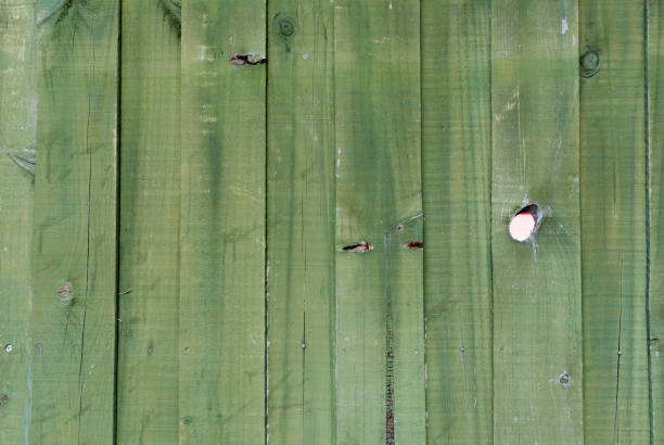 Green retro wooden fence background. stock photo
