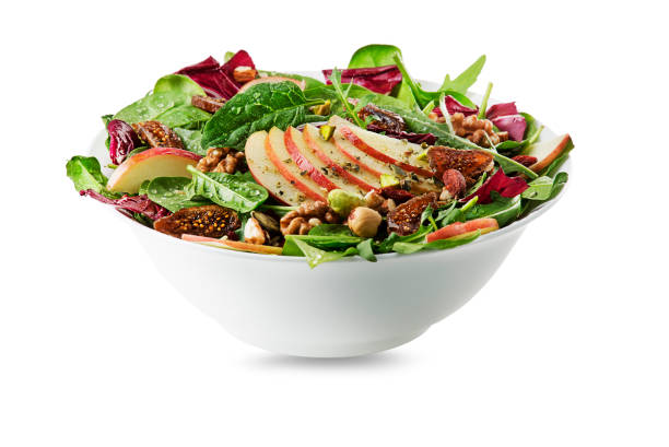 green salad with apple fruit and nuts - salad bowl imagens e fotografias de stock