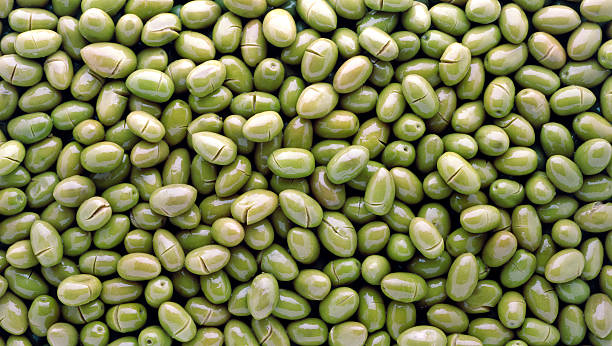 Green smashed olives stock photo