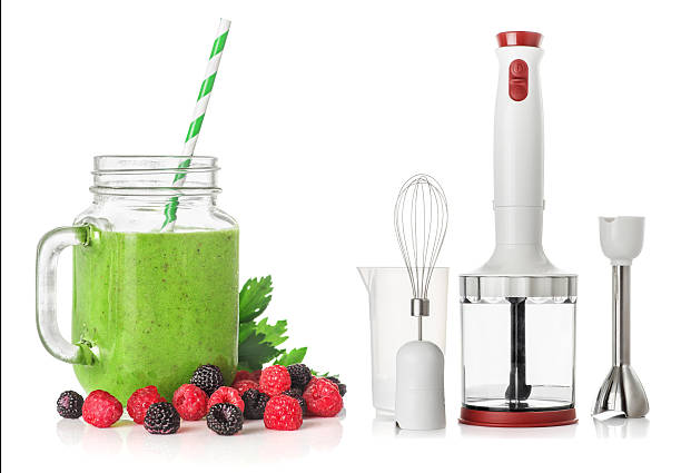 Green smoothies blender isolated on white background, healthy eating concept stock photo