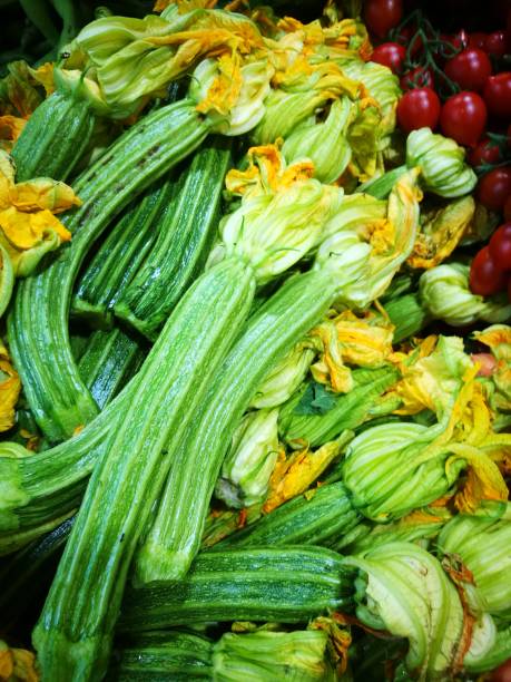 Green squash with blossoms stock photo