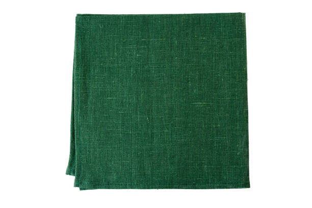 Green textile napkin on white Green textile napkin isolated on white background napkin stock pictures, royalty-free photos & images