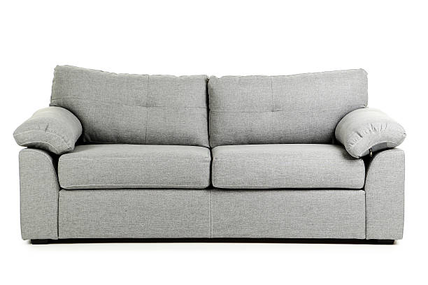 Grey sofa isolated on a white background stock photo