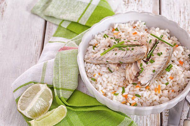 Grilled fillet of herring on rice stock photo