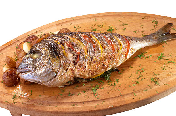 Grilled Fish with Lemon and Tomato stock photo