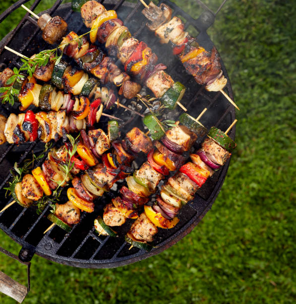Grilled skewers on a grilled plate stock photo