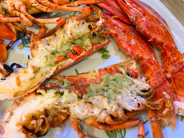 Grilled whole lobster with garlic and butter -  close up stock photo