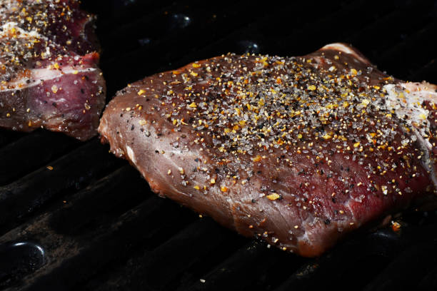 Grilling Steaks stock photo